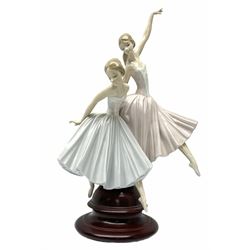 Lladro figure group, 'Merry Ballet', modelled as two ballerinas in dancing pose, raised on a turned socle base, no. 5035, printed marks beneath, H49cm