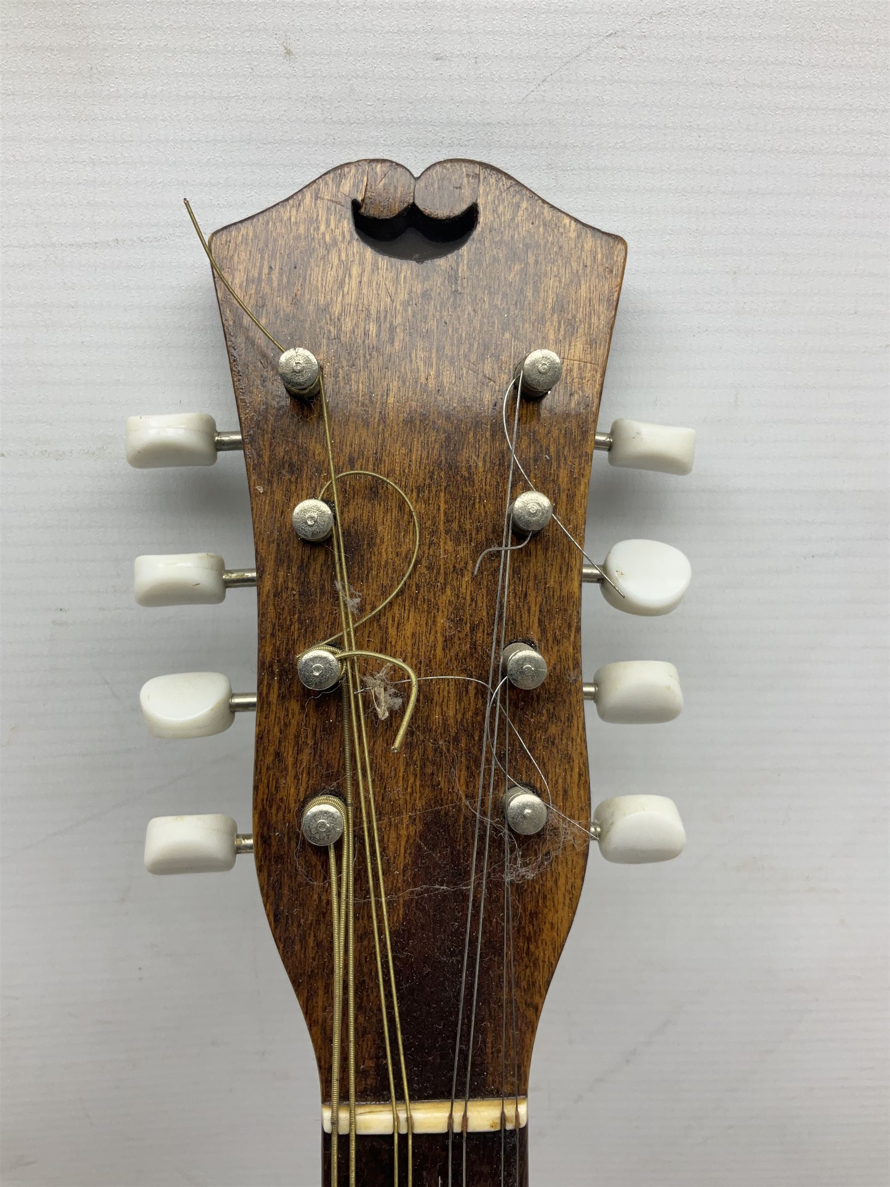 Italian eight-string mandolin with maple back and ribs and spruce top with inlaid floral marquetry panel within a fragmented mother-of-pearl border L61cm; cased; and a (damaged) German 'Michigan' mandolin for spares or repair (2)