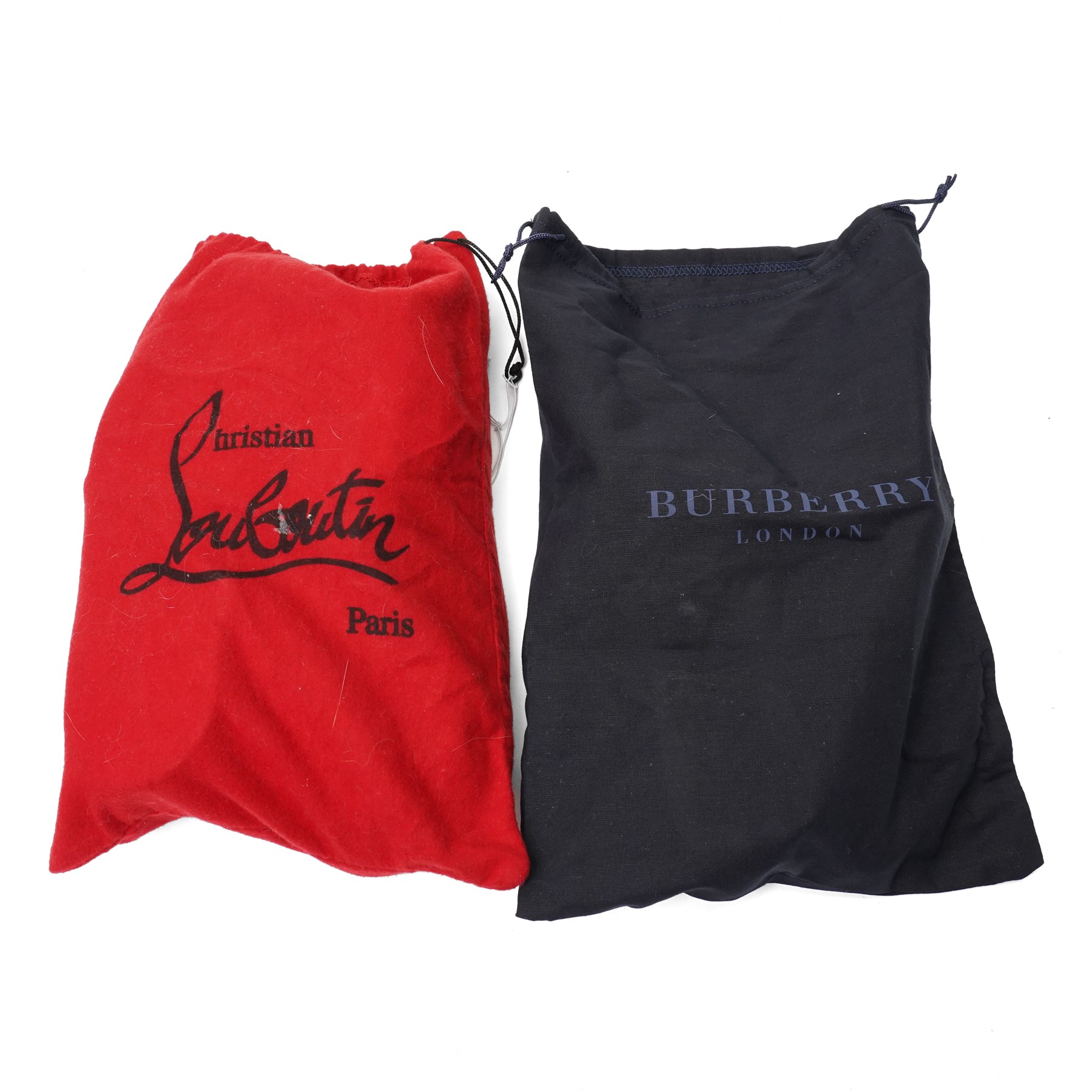 Christian Louboutin and Burberry - two pairs of designer shoes, comprising black leather Christian Louboutin low-top sneakers with black spike-studded toe caps and signature red soles, size 40, with dust bag, together with Burberry check canvas and red transparent strap sandals, size 39, with box and dust bag (2)