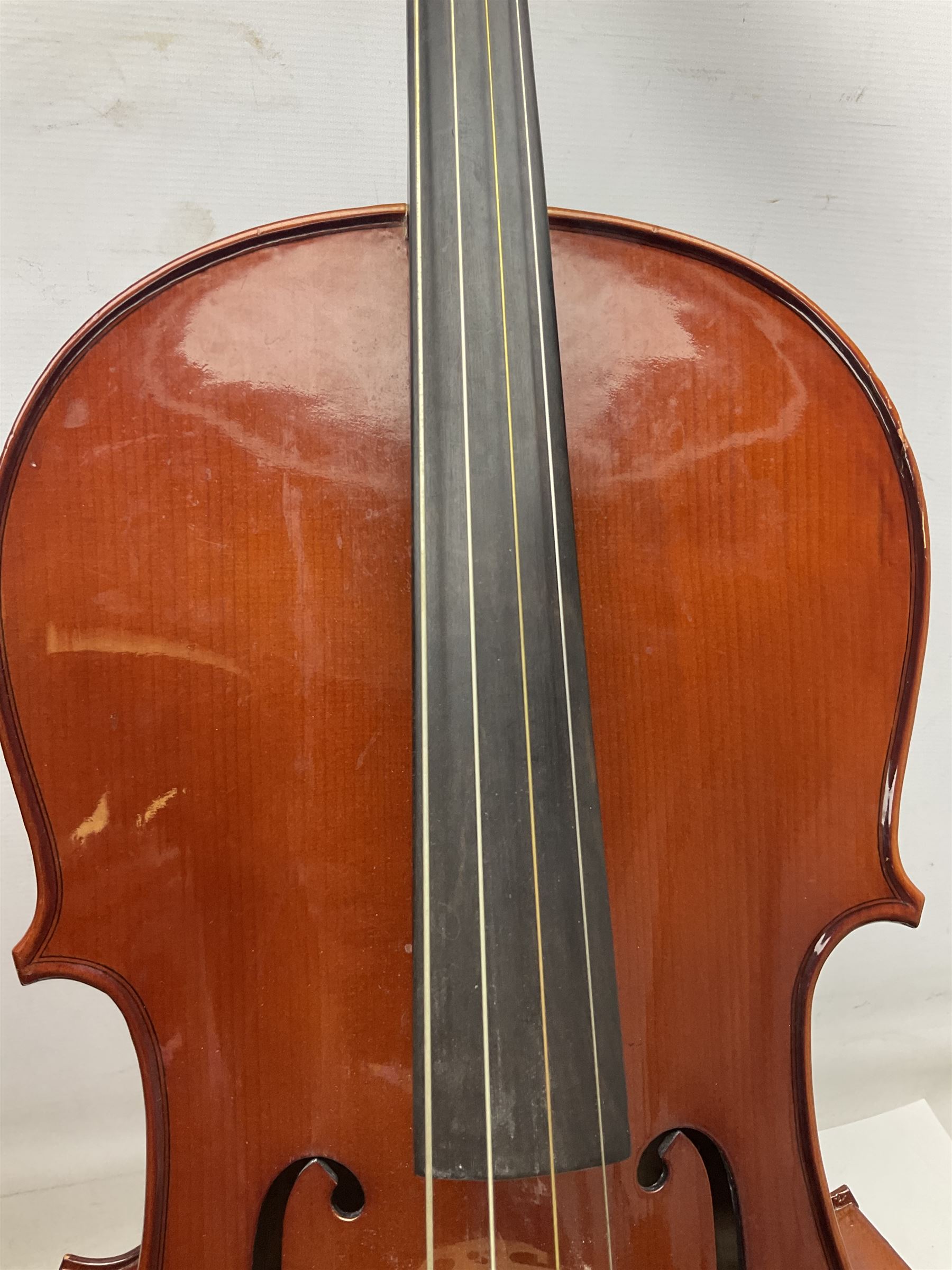 Modern Hungarian half-size cello with 69cm two-piece maple back and ribs and spruce top L114cm overall; and Stentor half size cello bearing label 'The Stentor Student II'; each in soft carrying case (2)