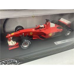 Five Mattel Hot Wheels 1:18 scale die-cast racing cars - Ferrari F1-2000 Michael Schumacher; Ferrari F-2002 Michael Schumacher; Jordan E-110 Heinz-Harald Frentzen; Williams F1 Team FW23Juan Pablo Montoya; and Ferrari F2001 Rubens Barrichello; all boxed (5)