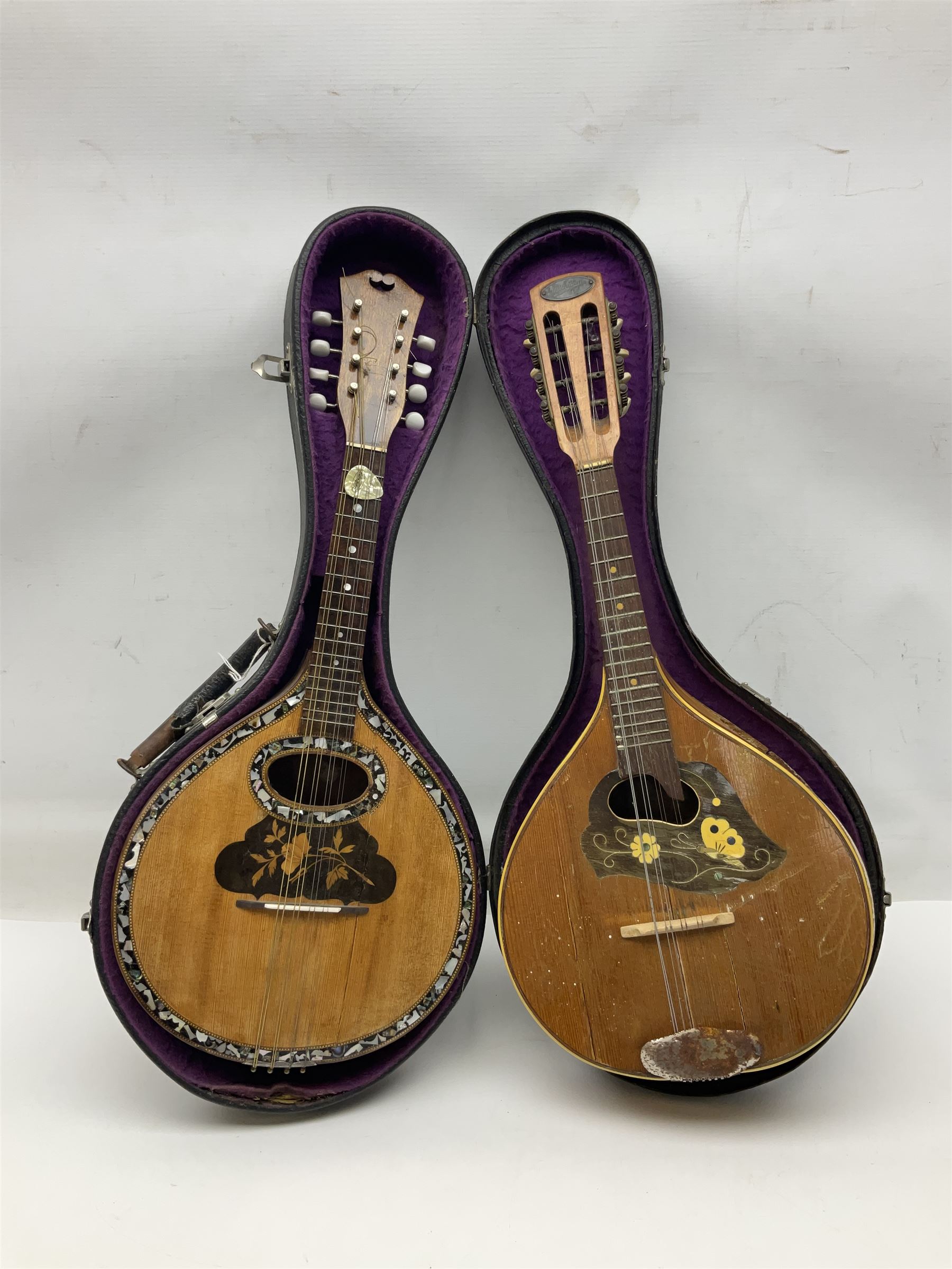 Italian eight-string mandolin with maple back and ribs and spruce top with inlaid floral marquetry panel within a fragmented mother-of-pearl border L61cm; cased; and a (damaged) German 'Michigan' mandolin for spares or repair (2)
