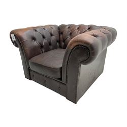 Mid-20th century Chesterfield armchair, upholstered in buttoned chocolate brown leather with studwork border, on castors