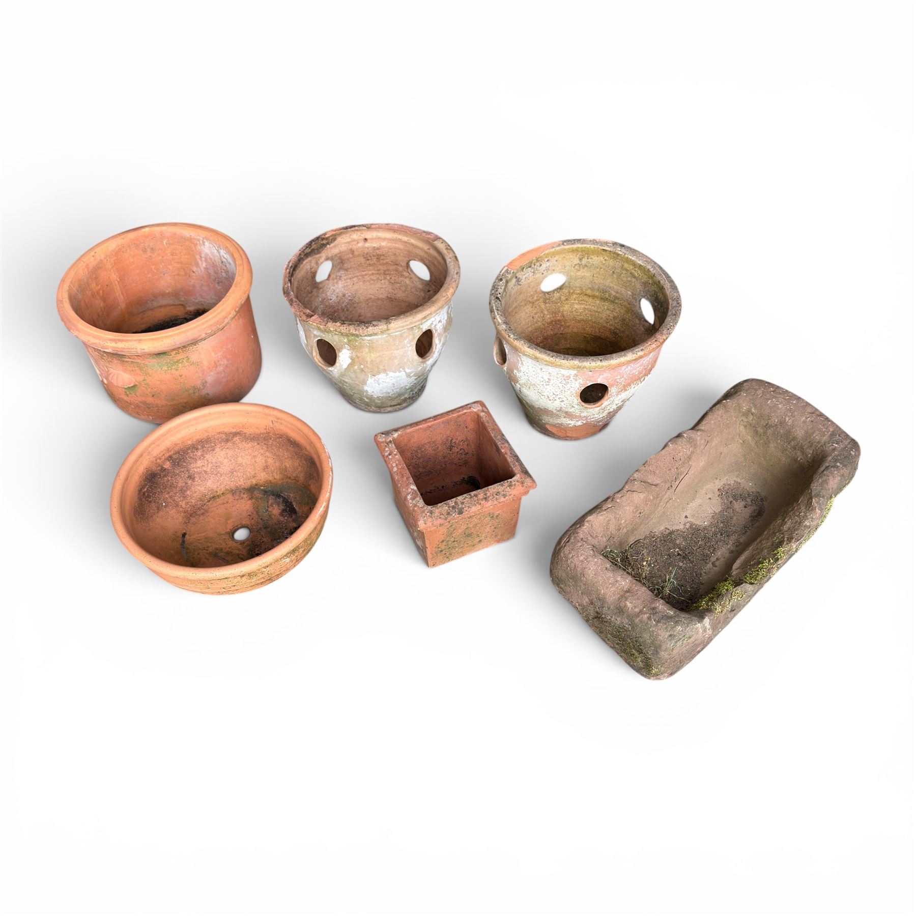 Collection of five terracotta garden planters along with rectangular sandstone trough 