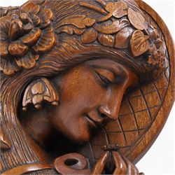 Art Nouveau style wall hanging,  carved as a woman holding a flower, H55cm