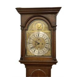 William Todd of Scarborough - early 18th century 8-day oak cased longcase clock c1730, with a flat top and deep cornice to the pediment, glazed side windows and a break arch hood door beneath with attached pilasters, long trunk door with an arched top on a reduced plinth with applied skirting, brass dial with cast spandrels and a father time automata to the arch, silvered chapter with Roman numerals and five minute Arabic's, quarter-hour and minute track,  plain dial centre with engraving and ringed winding holes, seconds dial and date aperture, movement pinned directly to an internal countwheel striking movement, striking the hours on a vertical bell. With pendulum and weights. 
William Todd is recorded as working in Scarborough 1720-d.1752..
