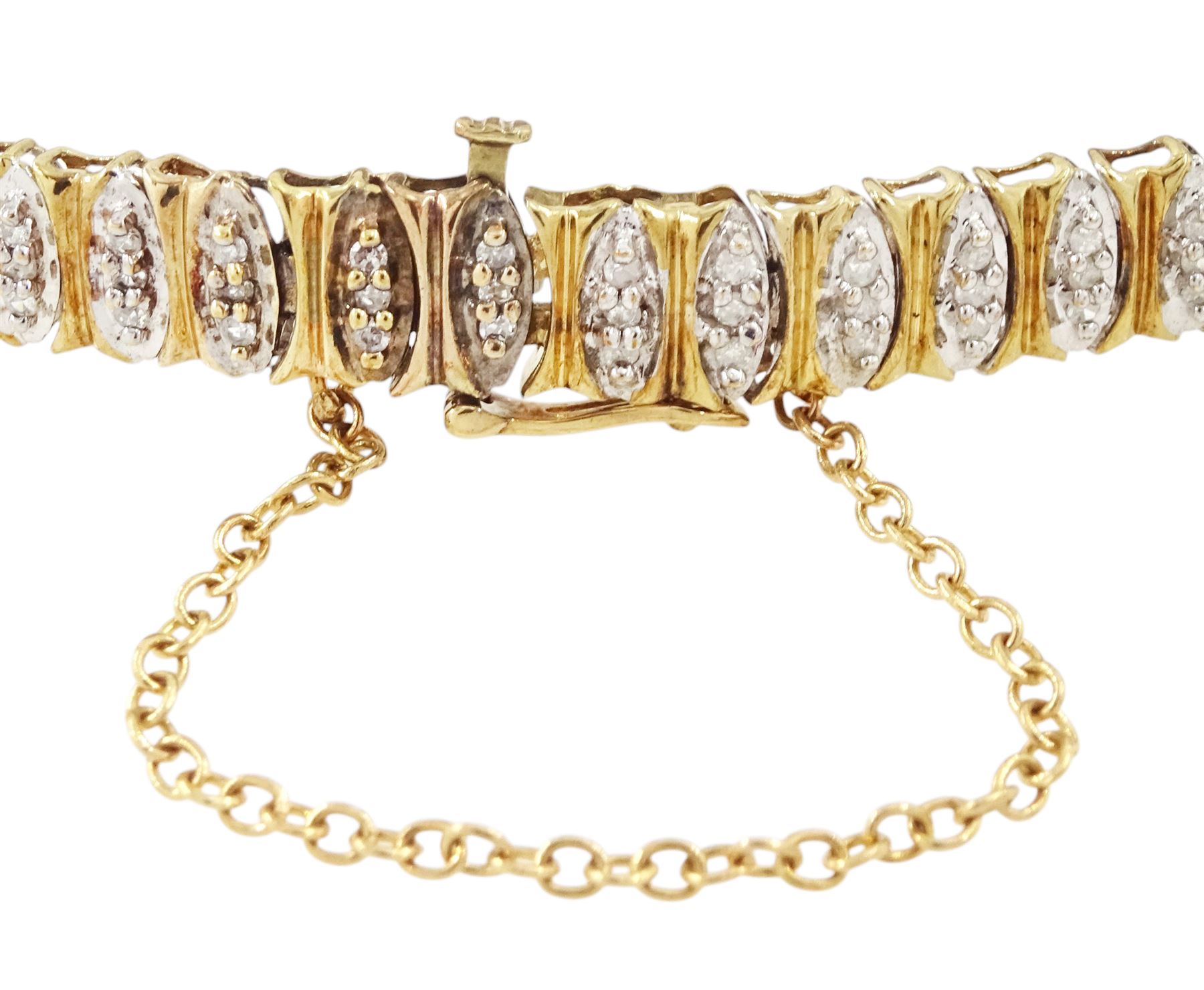 9ct gold diamond chip bracelet, forty-six white gold navette shaped links, each set with three single cut diamonds and with yellow gold surround, Birmingham import mark