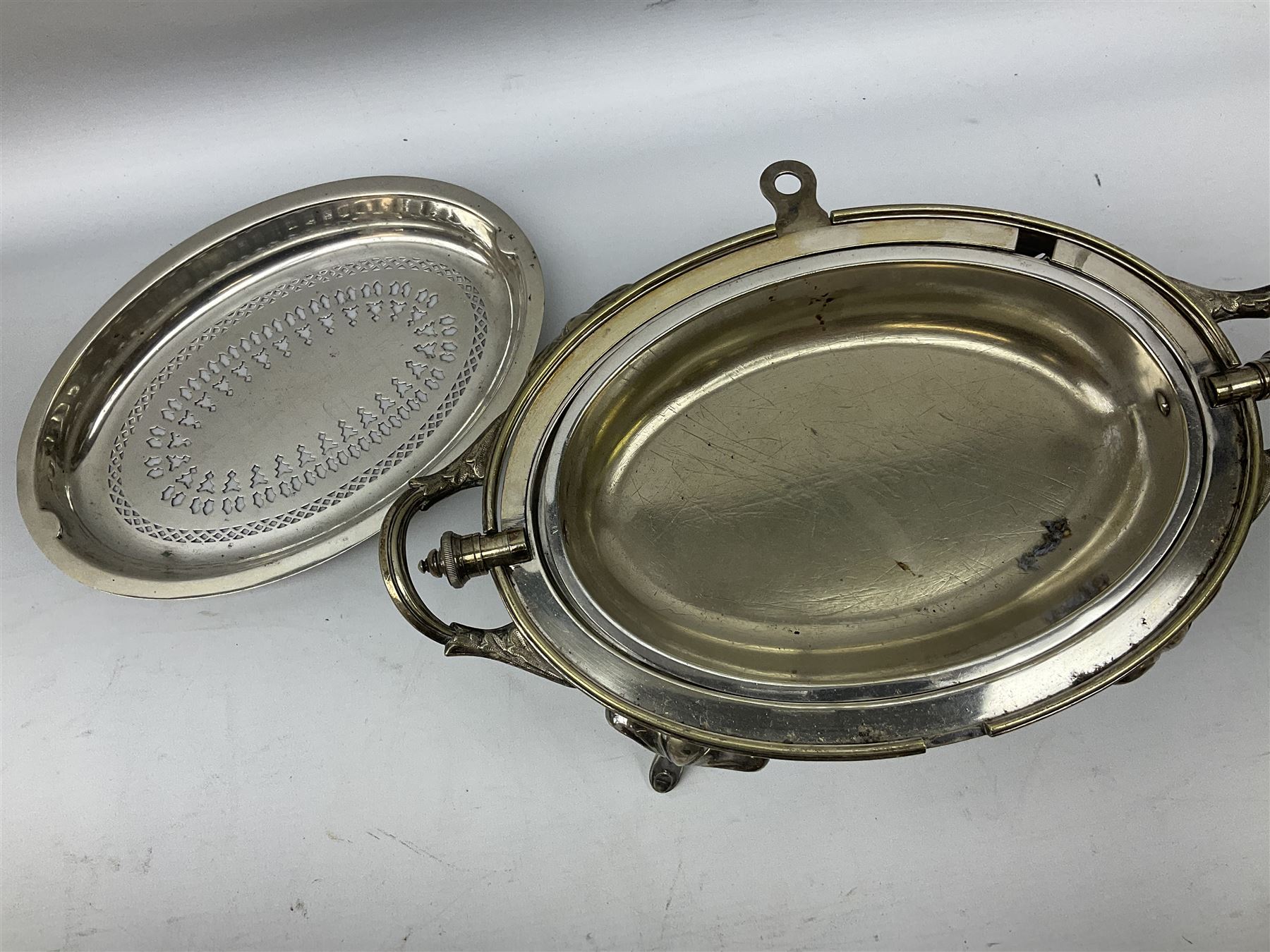 Collection of silver plate to include pair of Falstaff dwarf candlesticks in the 'Adam' style, weighted and raised upon fluted oval bases, together with Walker & Hall coffee pot, teapot, twin handled sucrier and jug in pattern no. 53602, and a Finnigans of Manchester entrée dish, the revolving top with engraved monogram