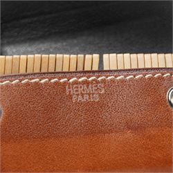 Hermès - ‘Mini-Dominos In-the-Pocket’ game, comprising miniature domino set in tan leather press-stud case, with original box and booklet