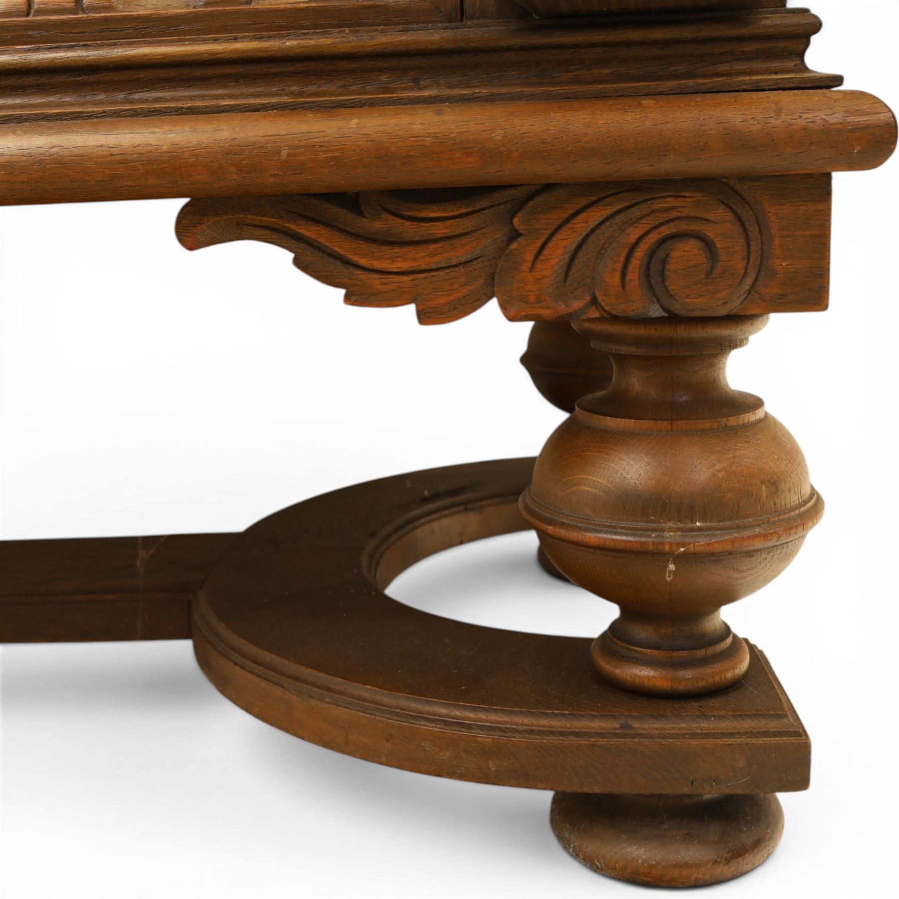 Carved oak coffer bench, rectangular moulded top above carved fall front, with figural, mask and foliate decoration, panelled sides, raised on turned bun feet with shaped lower apron