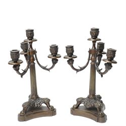 Pair of Neo Classical bronze four light candelabra with scroll branches and fluted columns...