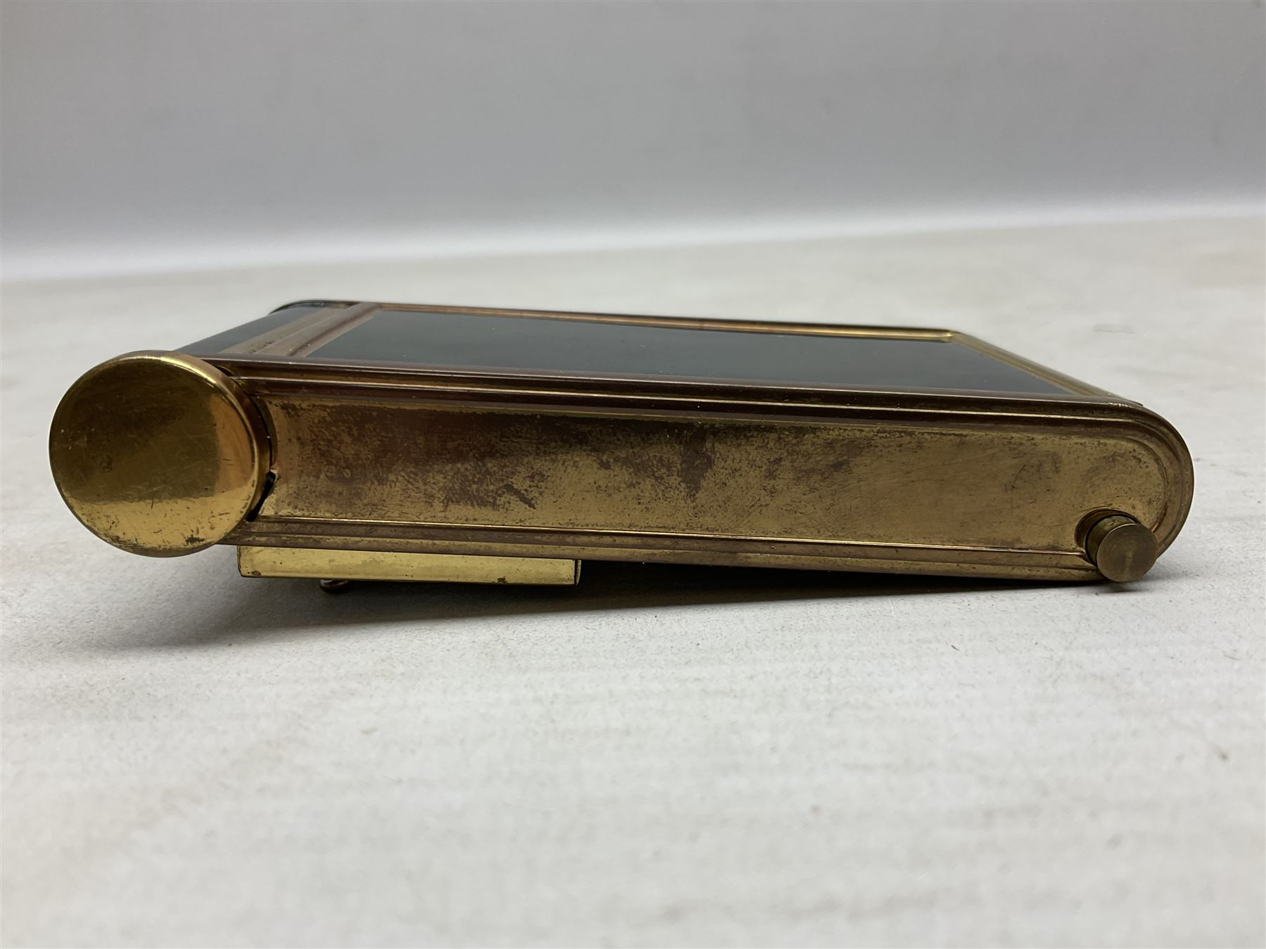 Art Deco camera shaped lady's musical compact and cigarette case, probably German, with green marble effect panels and gilt highlights, with large hinged opening to reveal engine turned brass interior with cigarette or lipstick holders, and the other side with musical mechanism and flip action powder compartment with mirror, L10cm