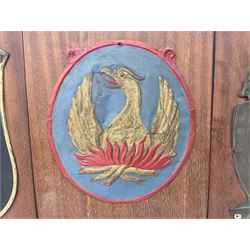 Four fire mark insurance plaques mounted on boards to include three Yorkshire examples and another depicting a raised phoenix amidst flames, one with label verso stating 'Removed From Bilton Haggs Old Farm House 1966', L30cm