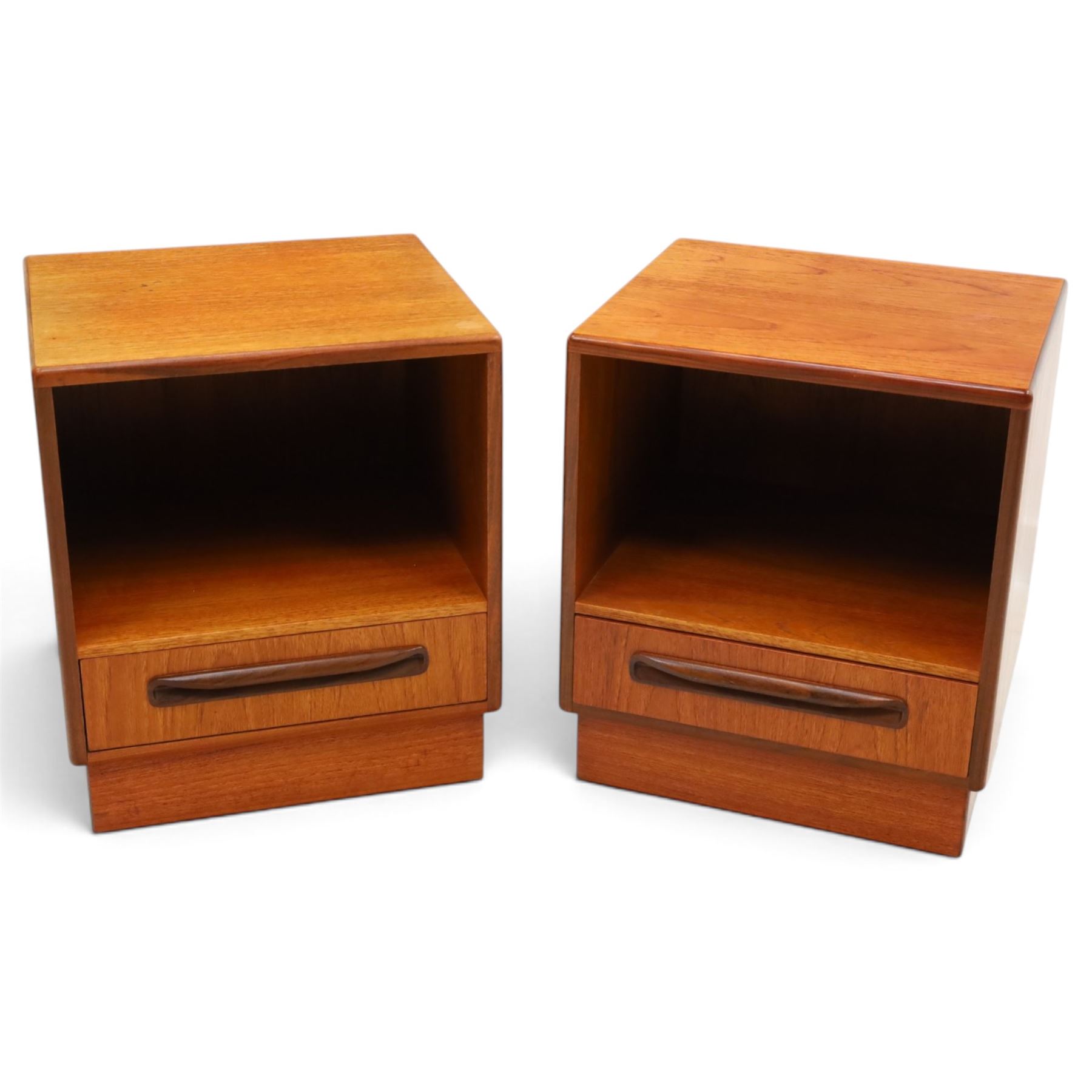 G-Plan - ‘Fresco’ teak pair of bedside cabinets, each with rectangular top over open recess and single drawer with sculpted handle, on plinth base