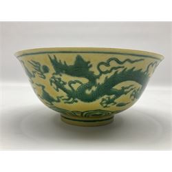 Pair of Chinese famille jaune bowls, decorated in green enamel with a dragon chasing a flaming pearl amongst clouds, upon a yellow ground, the interior decorated to centre with dragon, with six character mark beneath, D17.5cm