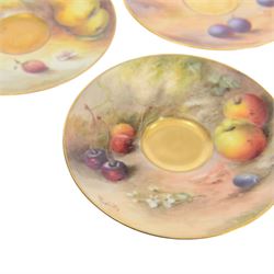 Two small 20th century Royal Worcester cabinet cups and saucers, together with another saucer, each painted with a still life of fruit upon a mossy ground, bearing various signatures: E Townsend, Ricketts, G H Cole, and H Ayrton, each with puce printed mark beneath, teacups approximately H3cm D5.5cm, coffee cup H4.5cm, saucers 9.5.cm