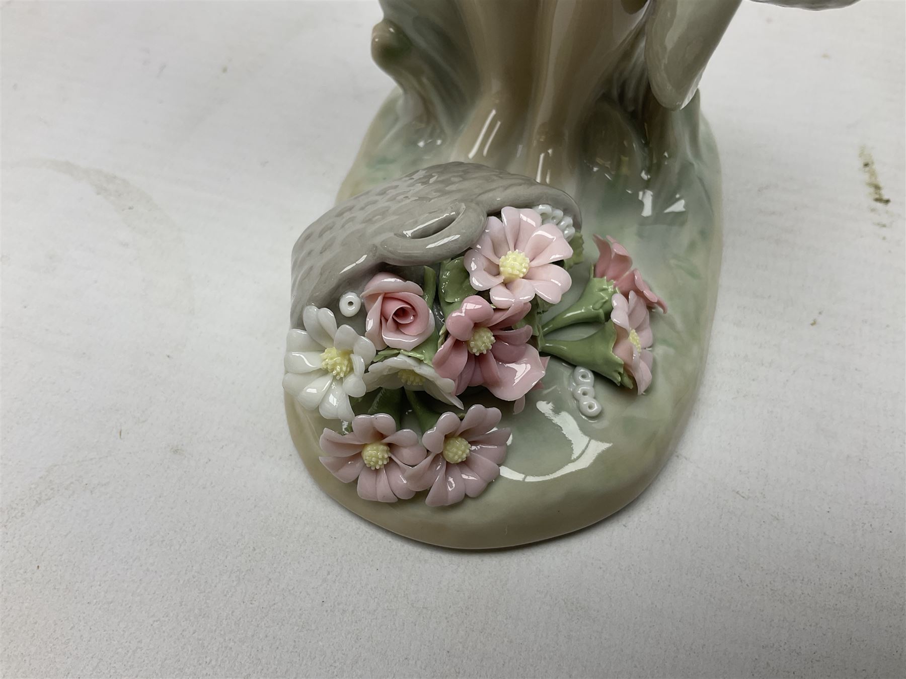 Three Lladro figures, comprising Modern Mother no 5873, Dropping the Flowers no 1285 and On the Beach no 1481, all with original boxes, largest example H30cm