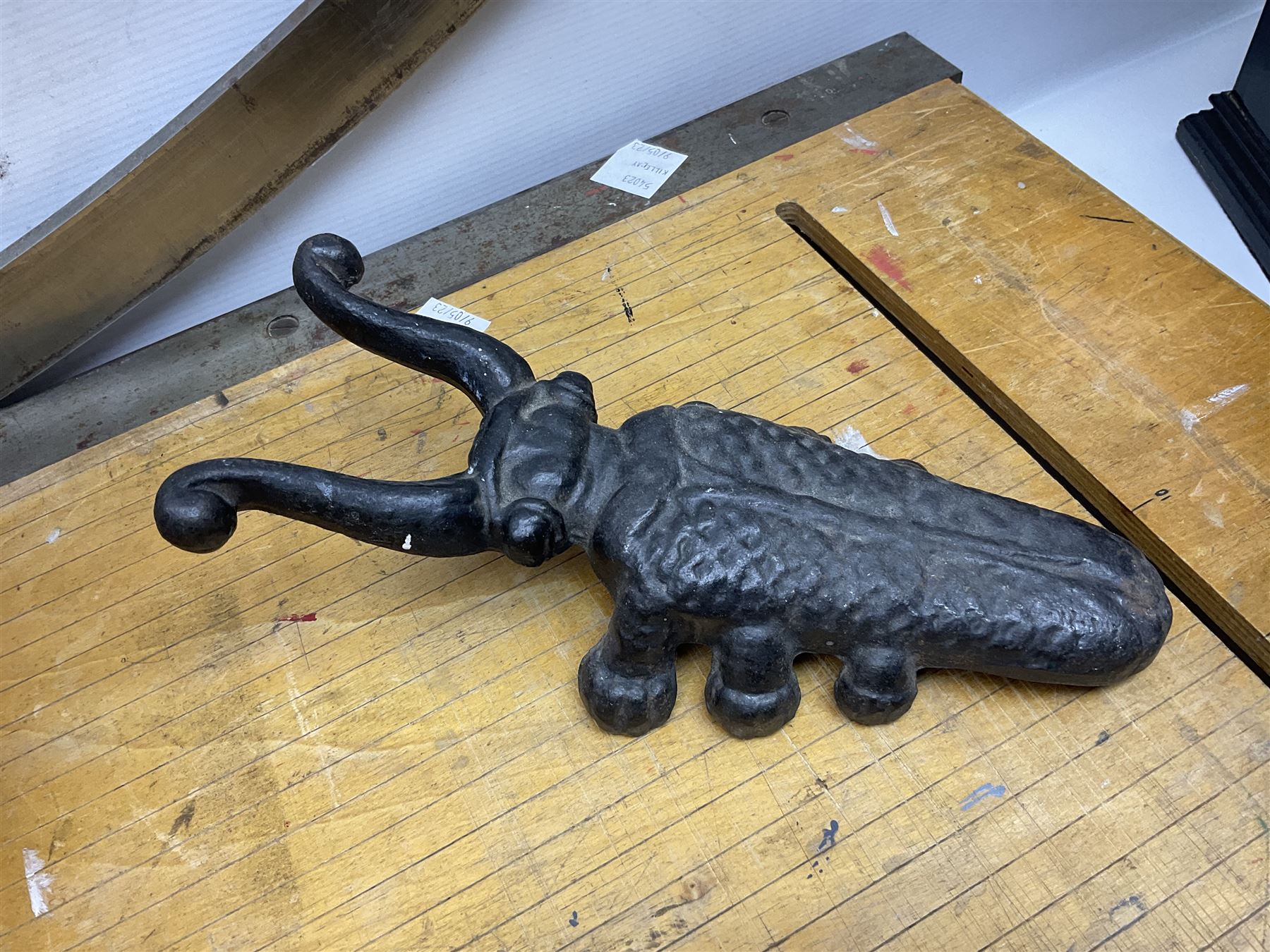 Coal bucket painted with flowers together with pair of bellows, boot scraper in the form of a beetle, wooden guillotine, composite table lamp with tassel lampshade and one other