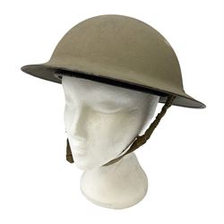 WW2 Home Front rough textured steel helmet dated 1941, drilled with three holes to signify not suitable for combat use, with original liner 