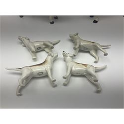 Beswick hunting group, comprising huntswoman on grey horse no 1730, huntsman on brown horse no 1501, fox figure no 1440 and eight fox hounds, all with printed marks beneath (11)