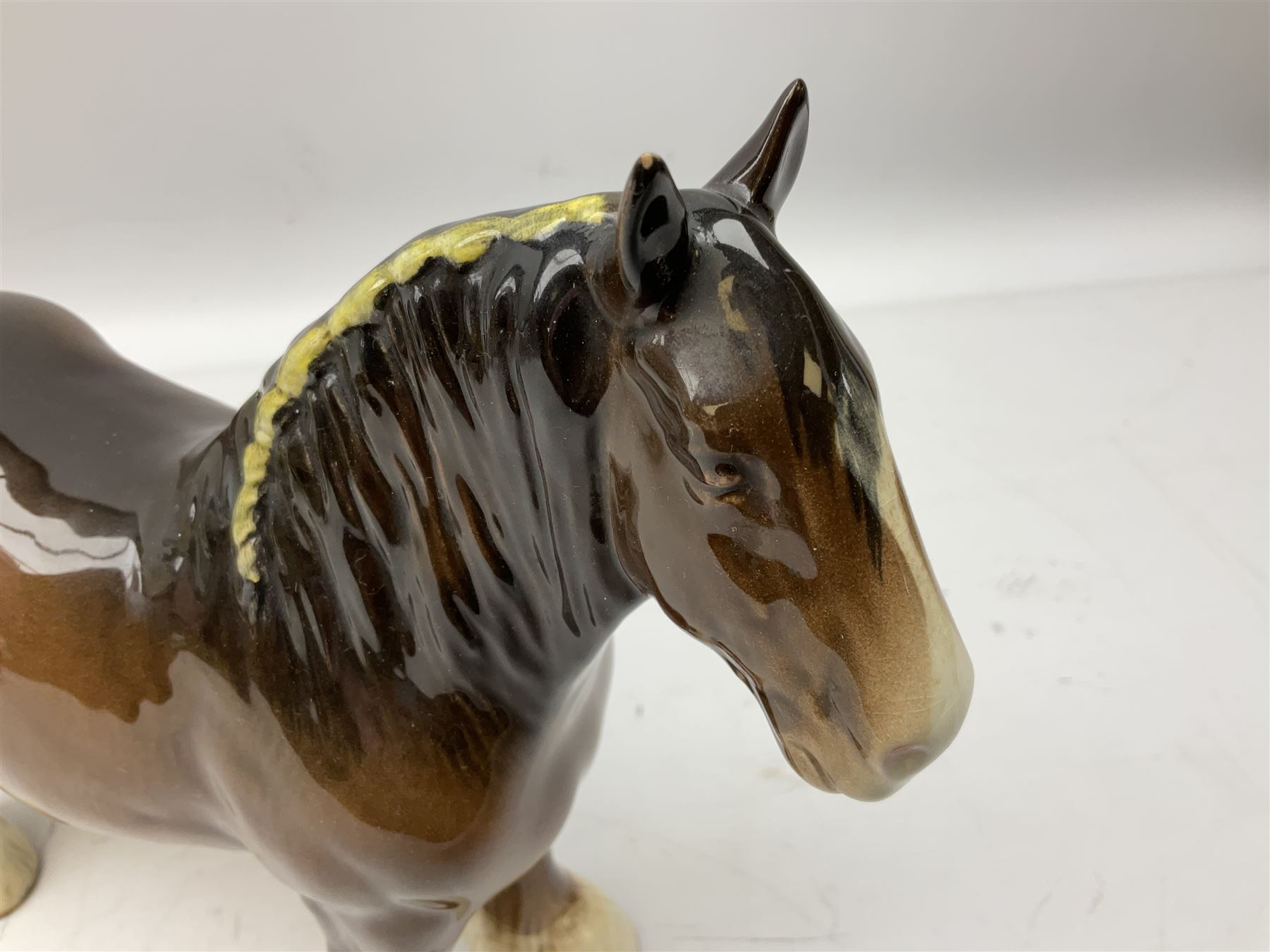 Three Beswick models comprising Hereford Bull no 949, 'CH Cutmil Cupie' Pug, and bay Shire horse, all with printed marks beneath