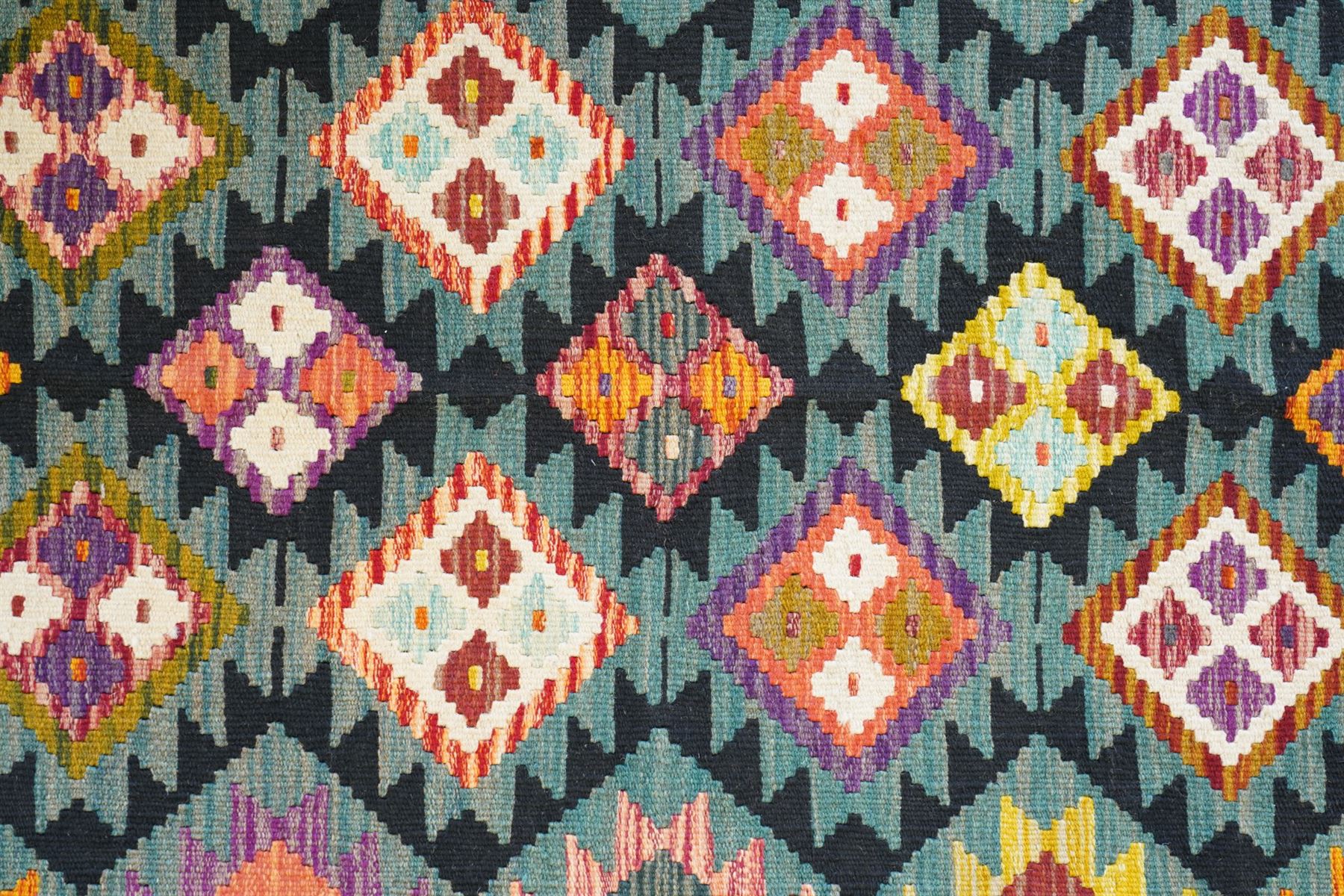 Maimana Kilim rug in shades of green, decorated with stepped lozenges 