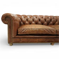 Timothy Oulton for Halo - three seat chesterfield sofa, deep button tufted back and arms in tan leather, loose seat cushions, studded detail to the scrolled arms and lower frieze, raised on turned bun feet