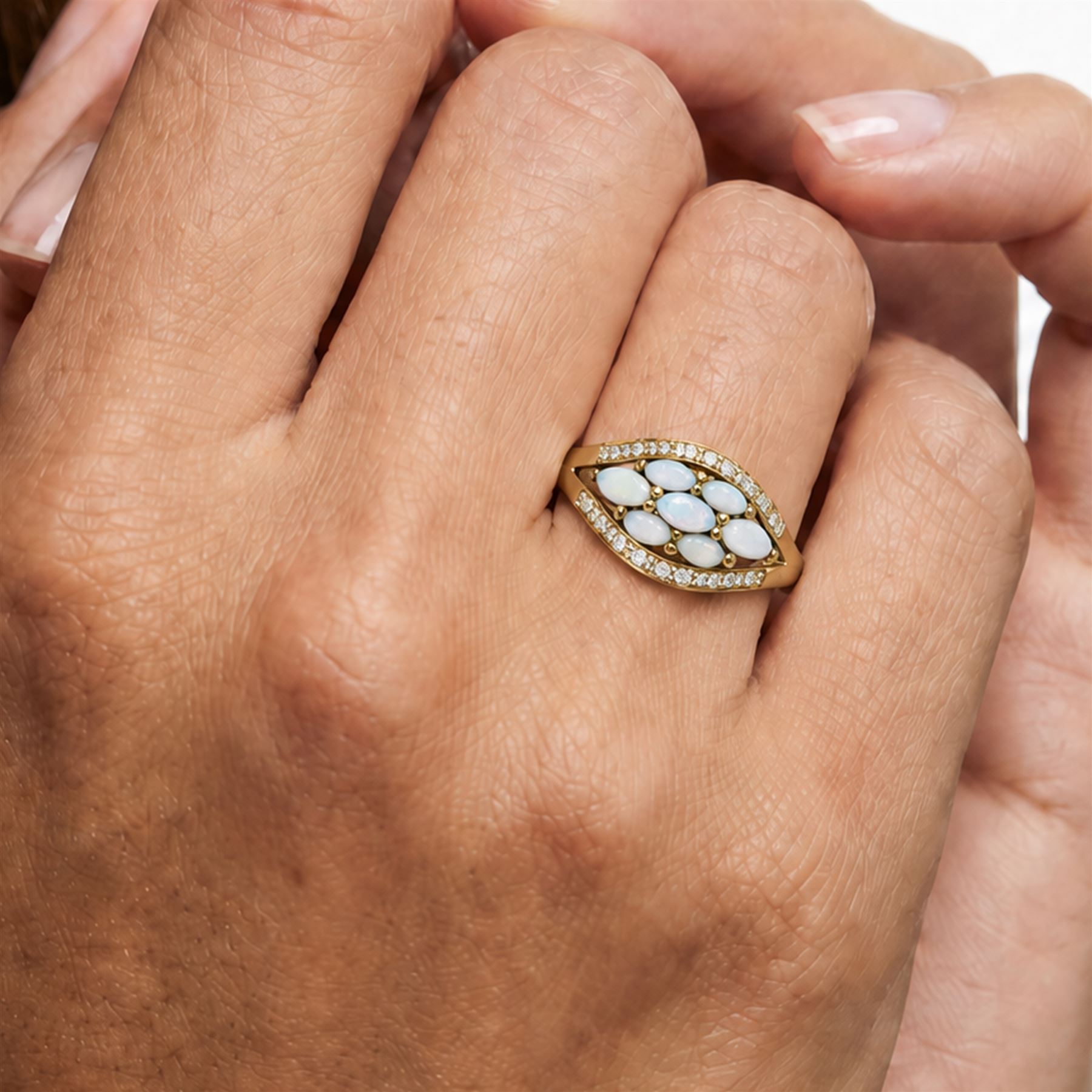 9ct gold opal and diamond cluster ring, seven marquise cut opals, surrounded by diamond chips, in a pierced design setting, Birmingham 2004