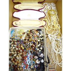  Collection of simulated pearl necklaces, ivory style bead necklaces, glass and other bead necklaces, two vintage manicure sets, 19th century cast metal cow finial, vintage Kleenware ship cruet, Chinese lacquer box, 1935 crown and miscellanea in two boxes  