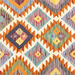 Afghan Chobi flatweave kilim with a repeating stepped diamond medallion design in ivory, green, rust, teal, purple, indigo and framed by chevron and geometric borders