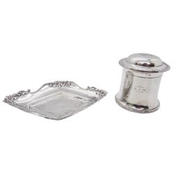 Edwardian silver jar and cover, of cylindrical form with engraved date to body, the domed cover with engraved monogram, and cover and body with reed and ribbon border, hallmarked James Deakin & Sons, Chester 1902, H8cm, together with an Edwardian silver pin dish, of lozenge form with embossed flower head rim, hallmarked James Dixon & Sons Ltd, Sheffield 1903, W15.5cm, approximate total weight 6.27 ozt (195.2 grams)