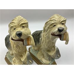 Pair of cast iron Dulux Old English sheepdog doorstops together with another modelled as a golfer