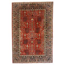 Anatolian crimson ground tribal rug, the field decorated with repeating geometric tree of ...