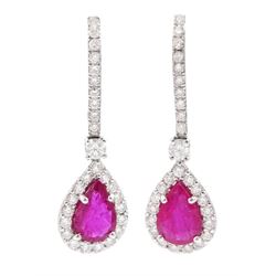 Pair of 18ct white gold, pear cut ruby and round brilliant cut diamond pendant stud earrin...