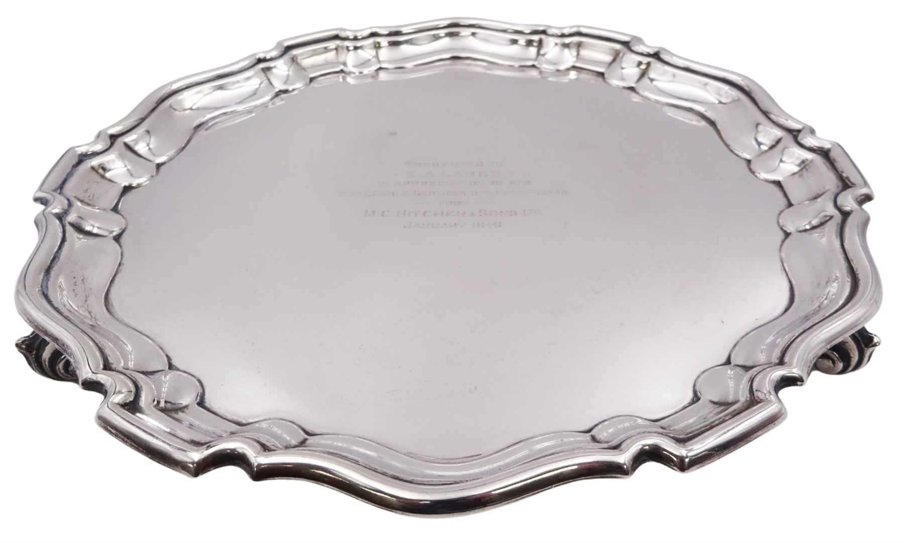 1940's silver waiter, of circular form with Chippendale type rim and personal engraving to centre, upon three scroll feet, hallmarked William Suckling Ltd, Birmingham 1934, D20cm, approximate weight 10.70 ozt (332.9 grams)