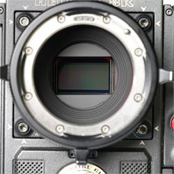 RED Epic-W Helium 8K camera body serial no. 13024E6A9, with RED EVF, three RED Mini Mag 512GB cards, one 480 Mini Mag card and reader, two RED V-Mount batteries and charger, RED top handle, Wooden Camera Easy Top top plate and one other top plate, various accessory cables, Wooden Camera bridge plate for 19mm studio rods, 12 inch Wooden Camera Dovetail plate and four 19mm studio rods to include two 380mm and two 610mm, with original Epic-W camera box and contained within a custom cut flight case