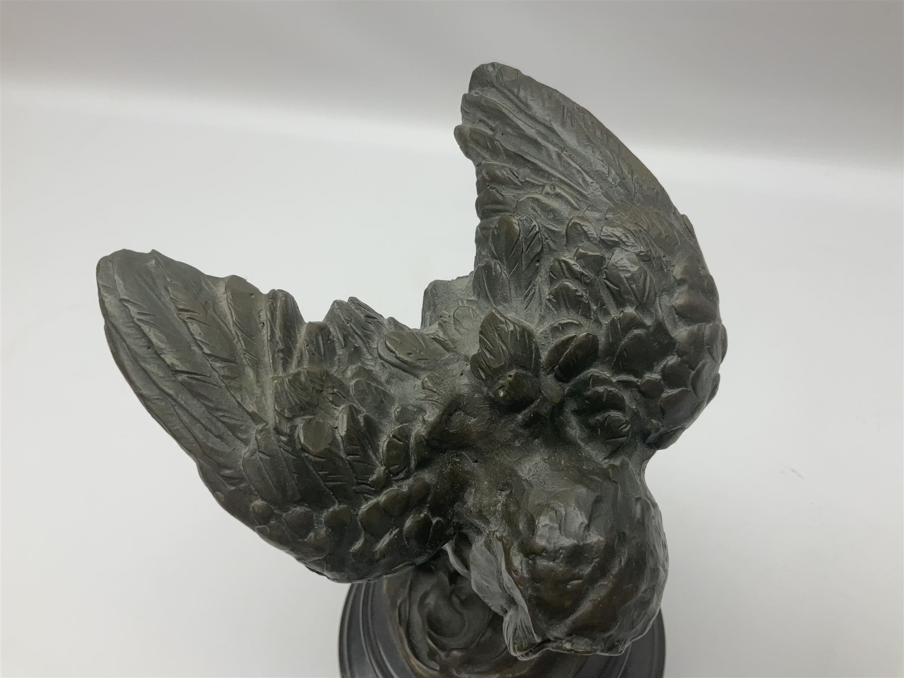 Bronze figure, modelled as an owl upon a rock, on stepped circular base, after Milo, H24.5cm