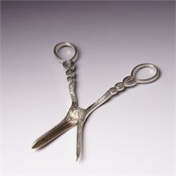 Pair of Victorian silver grape scissors with engraved decoration Birmingham 1860 Maker probably John Gilbert and a small silver sauce boat with crimped rim and C scroll handle Birmingham 1905 Maker Thomas Hayes (2)  