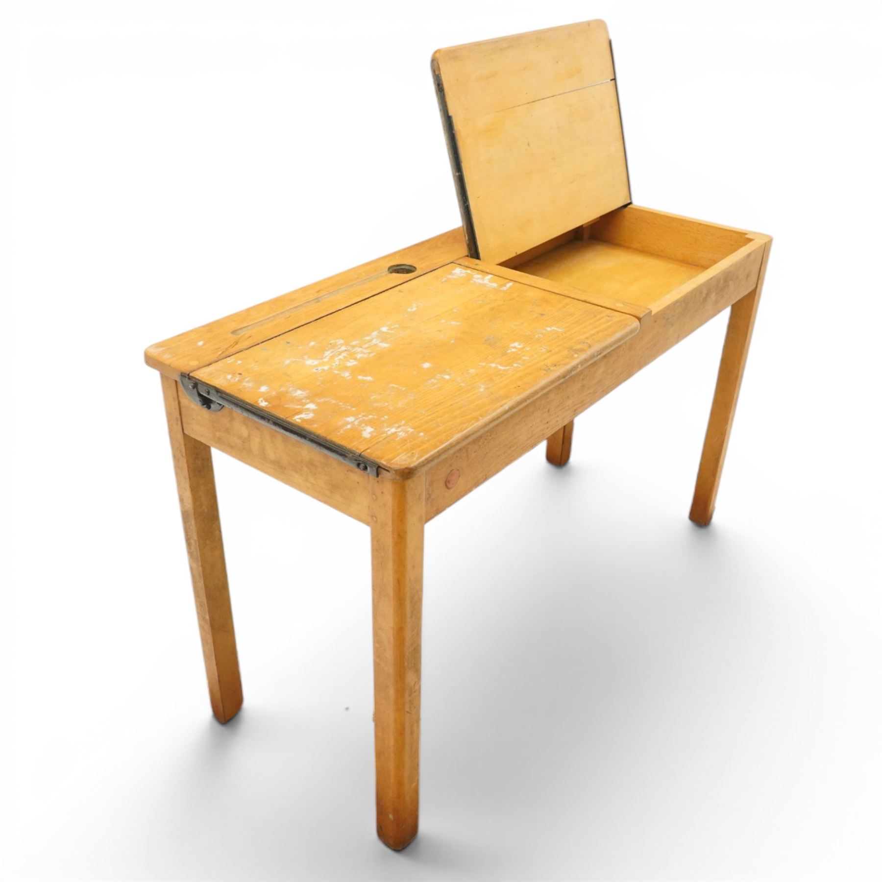 Mid-20th century beech double school desk, twin hinged desk-top compartments with inset pen and ink tray, on square supports
