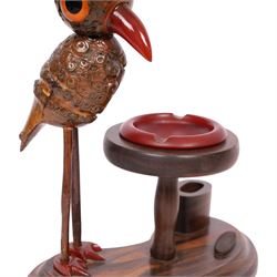 Henry Howell & Co., YZ bird novelty smokers stand, circa 1920-30's, with novelty nut bird with Bakelite beak and tail, with removable Bakelite ashtray on raised wooden plinth, with match holder and striker to the base, stamped YZ TRADE MARK MADE IN ENGLAND to base, 23cm, L21cm  