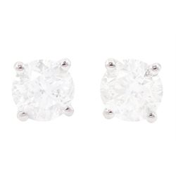 Pair of 18ct white gold diamond earrings, each stud set with a round brilliant cut diamond...