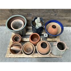 A quantity of various terracotta and glazed planters