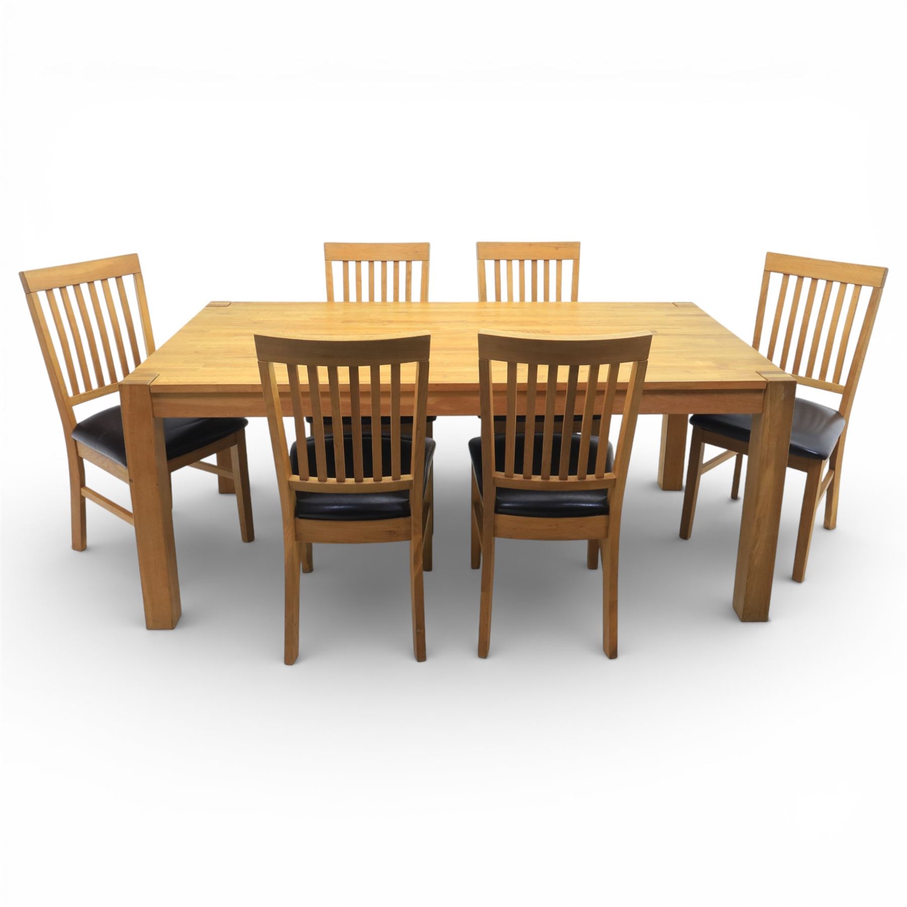 Solid light oak extending dining table with single leaf, and set of six chairs
