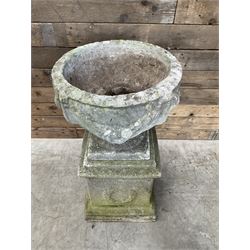 Cast stone centerpiece urn on plinth
