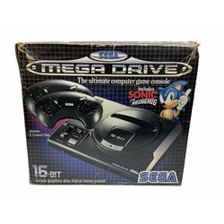 1990s Sega Megadrive 16bit games console with five games comprising Sonic the Hedgehog, Fifa International Soccer, Mickey Mouse Castle of Illusion, MicroMachines 2 Turbo Tournament and 1994 Lillehammer Winter Olympics, boxed with instructions