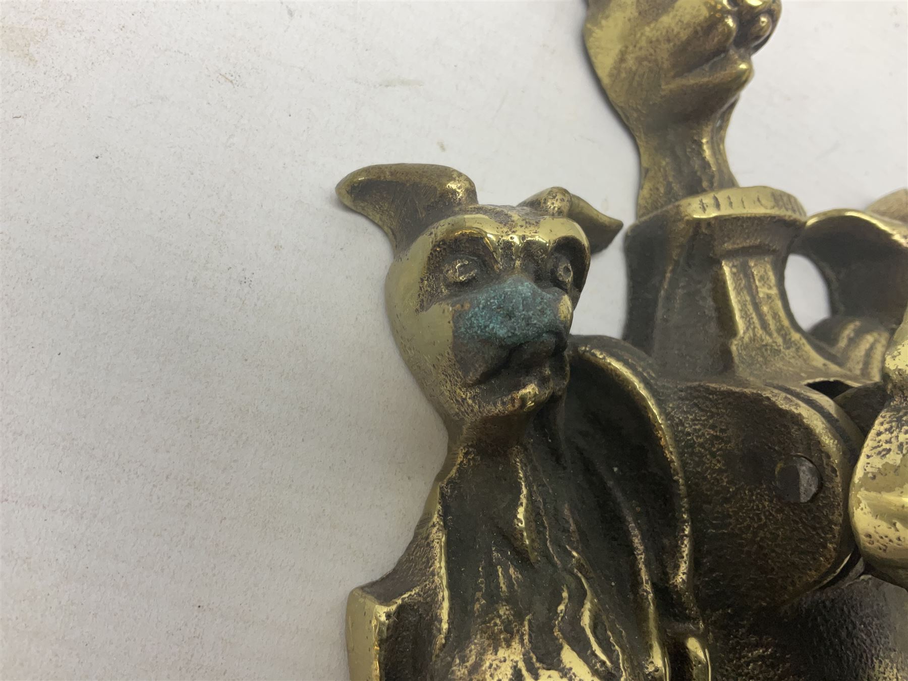 Gothic style cast brass door knocker, modelled with the Greek three-headed hell hound Cerberus on Rococo style base with central knocker of tear drop above Hades, God of the underworld, L29cm