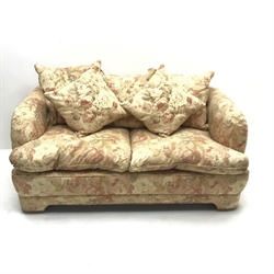 Two seat sofa upholstered in a cream ground floral pattern fabric (W168cm) 
