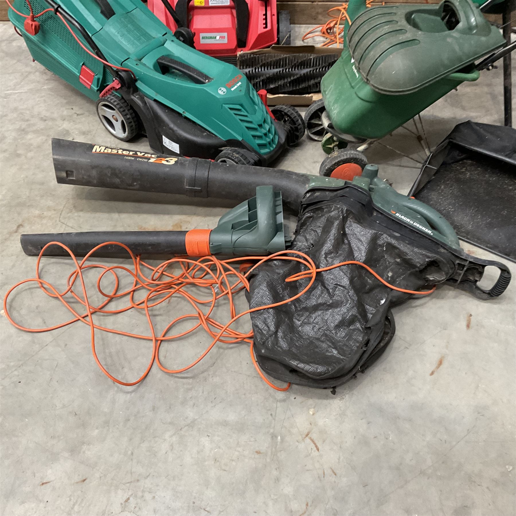 A Bosch Rotak 34R lawn mower, a Bergman Pro 3in1 Scarficer, Rake & Sweeper, a Black &Decker GS1800 chipper, a strimmer and a blower
