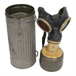WWII German armed forces gas mask, housed in the original issue tin, tin H27cm