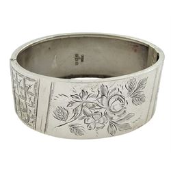 Silver hinged bangle with bright cut foliate decoration by Kenart Ltd, Birmingham 1934